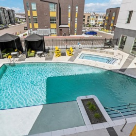 Shimmering resort-style pool a pool in a backyard